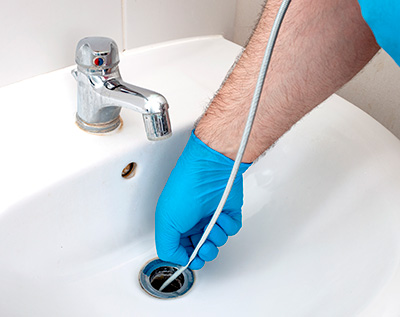 Drain cleaning sink